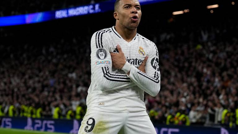 Kylian Mbappé in a Real Madrid shirt, setting his sights on the European summit, packed stadium